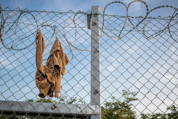 Clothes on razor wire fence