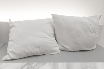 white pillow put on seat