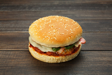 Meet and cheese burger at rustic wood