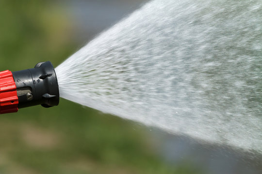 stream of water from a fire hose