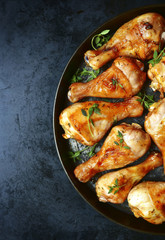 Grilled chicken legs with thyme.