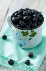 blueberry on wooden surface