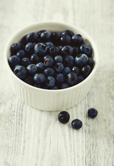 blueberry on wooden surface