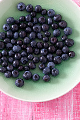 blueberry on wooden surface