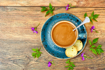 Coffee  in a blue retro cup with Flowers
