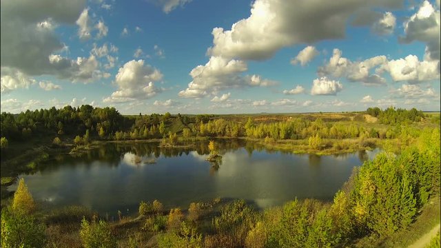 Flight over the lake in autumn