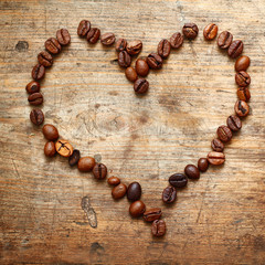 Coffe heart on old wooden background