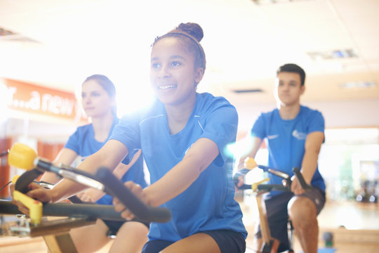 Young woman on exercise bike