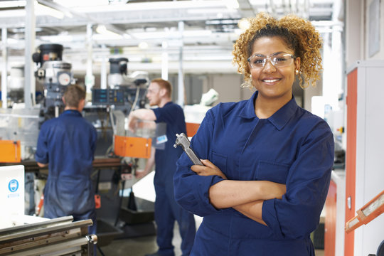 Portrait of female student in workshop at college
