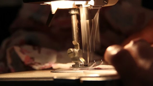 Woman work on the sewing machine