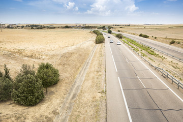 Fototapeta na wymiar landscape with a highway in the plain on a summer day