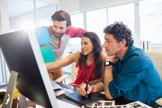 Colleagues Using A Graphic Pad