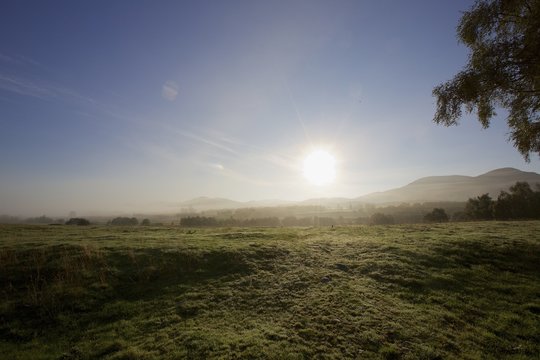 Sunlight over field, Loch Ness, Whitebridge, Scotland