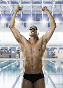 Male swimmer punching the air