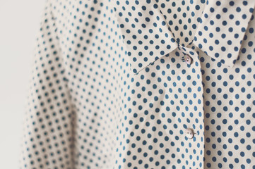 Ladies, women clothes, polka dot shirt,  silk blouse on clothing rail, selective focus © malinkaphoto