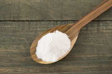 Sodium bicarbonate in a wooden spoon