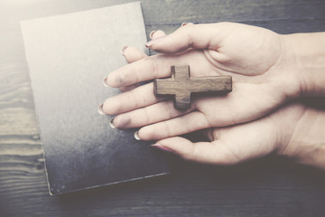 cross, book and woman hand