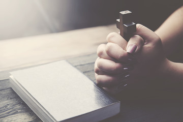 cross, book and woman hand