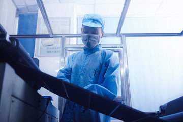 Worker at e-cigarettes battery factory, Guangdong, China