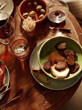 Antipasto starters with olives, chorizo, salami, cheese,  parma ham with wine