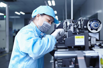 Worker at e-cigarettes battery factory, Guangdong, China
