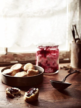 Rustic windowsill with rosella jam and puftaloons (fried scones)