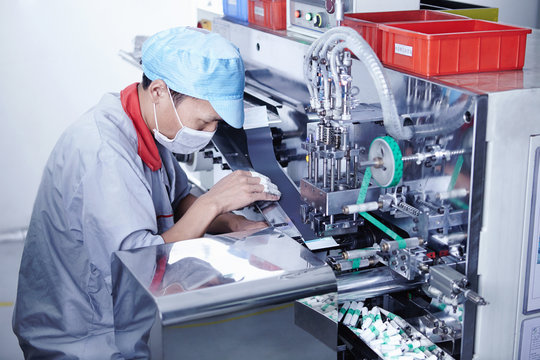Worker at e-cigarettes battery factory, Guangdong, China