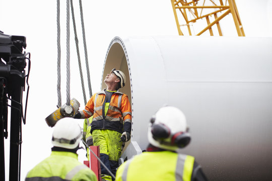 Construction workers checking ropes