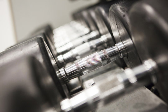 Dumbbells in a row, close-up