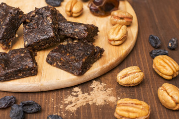 Chocolate candy at home with dates, nuts and raisins