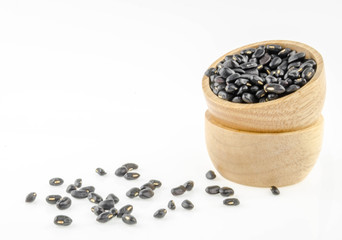 Fototapeta na wymiar Black beans in a cup on a white background.