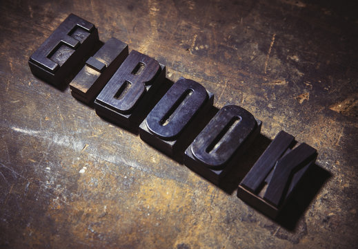 Letterpress letters spelling the words E Book