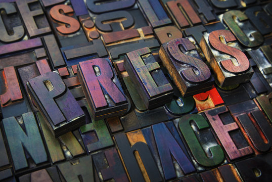 Letterpress letters spelling the word Press