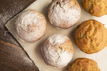 Sweet, lush cupcakes, dusted with powdered sugar