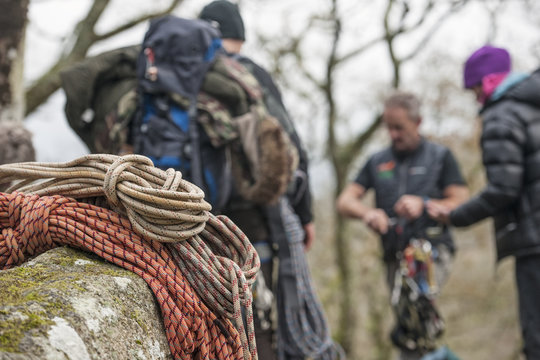 Climbing ropes on rocks with climbers in background