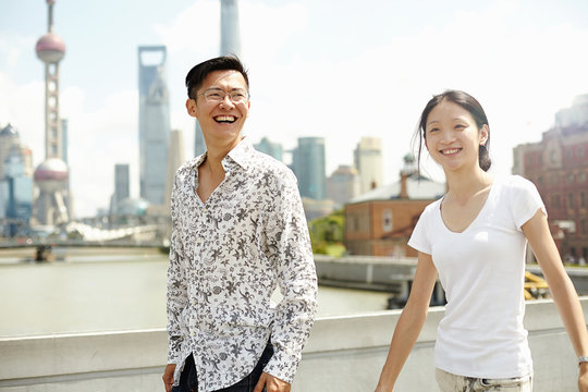Tourist couple strolling, The Bund, Shanghai, China