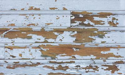 Old lead paint peeling off of wood sliding