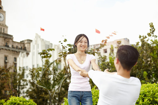 Tourist couple dancing, The Bund, Shanghai, China