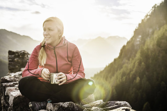Young woman on top of Ehrenberg castle ruins, Reutte, Tyrol, Austria
