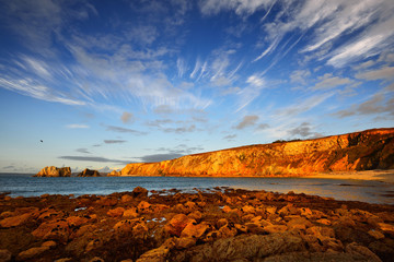 View of an ocean coastline during sunset at Pointe de Toulinguet in Brittany, France