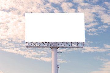 Blank billboard ready for new advertisement with blue sky backgr