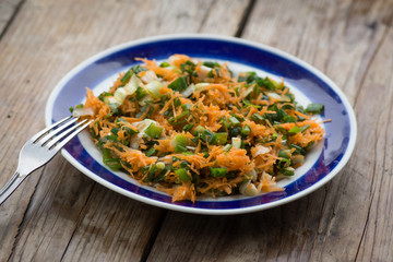 Fresh healthy salad on the rustic wooden table