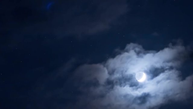 A moon for the sky with the stars and clouds moving along with the rotation of the Earth. time lapse
