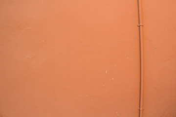 orange wall with pipeline