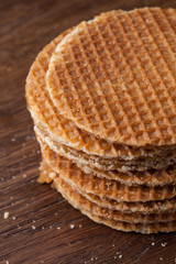 Waffles with caramel on wood