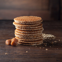 Waffles with caramel on wood