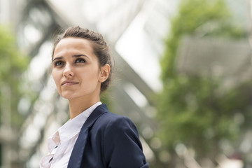 Confident young businesswoman at Broadgate Tower, London, UK