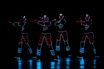 Fototapeta na wymiar dance team in costumes of the LEDs
