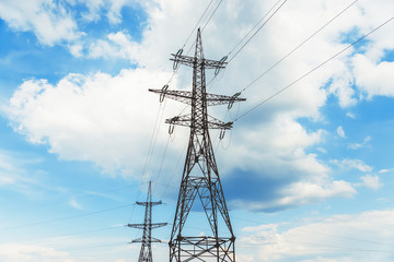 high voltage tower on clouds background