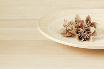 Home decor. Craft flowers. Wood background. Copy space.